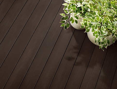A deck stained with Cordovan Brown ES-62 Semi-Solid Woodluxe® Exterior Stain. A deck stained with Cordovan Brown ES-62 Semi-Solid Woodluxe® Exterior Stain.
